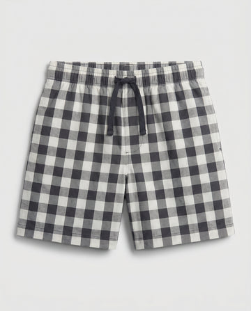Boys' woven cotton pull-on short pant in navy and off-white block check with adjustable drawstring waist, flat lay product photo