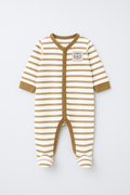 Striped baby onesie with a small patch on a white background
