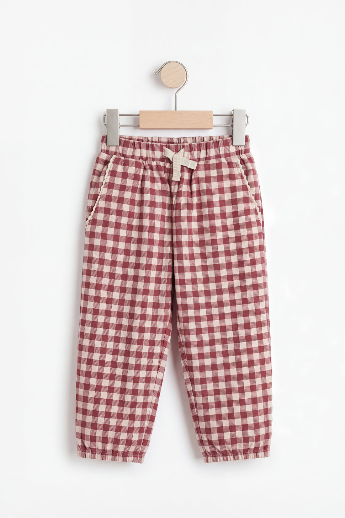 Hanger flat shot: PTex Fashion girls' berry and cream gingham cotton pull-on trousers with cuffed hem