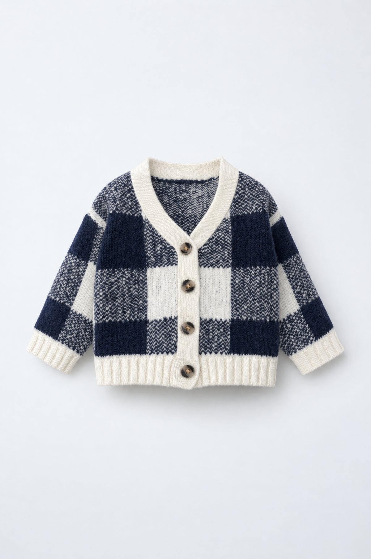 PTex Fashion baby check knit cardigan in navy and ecru with V-neck, ribbed trims and tortoiseshell buttons, front view