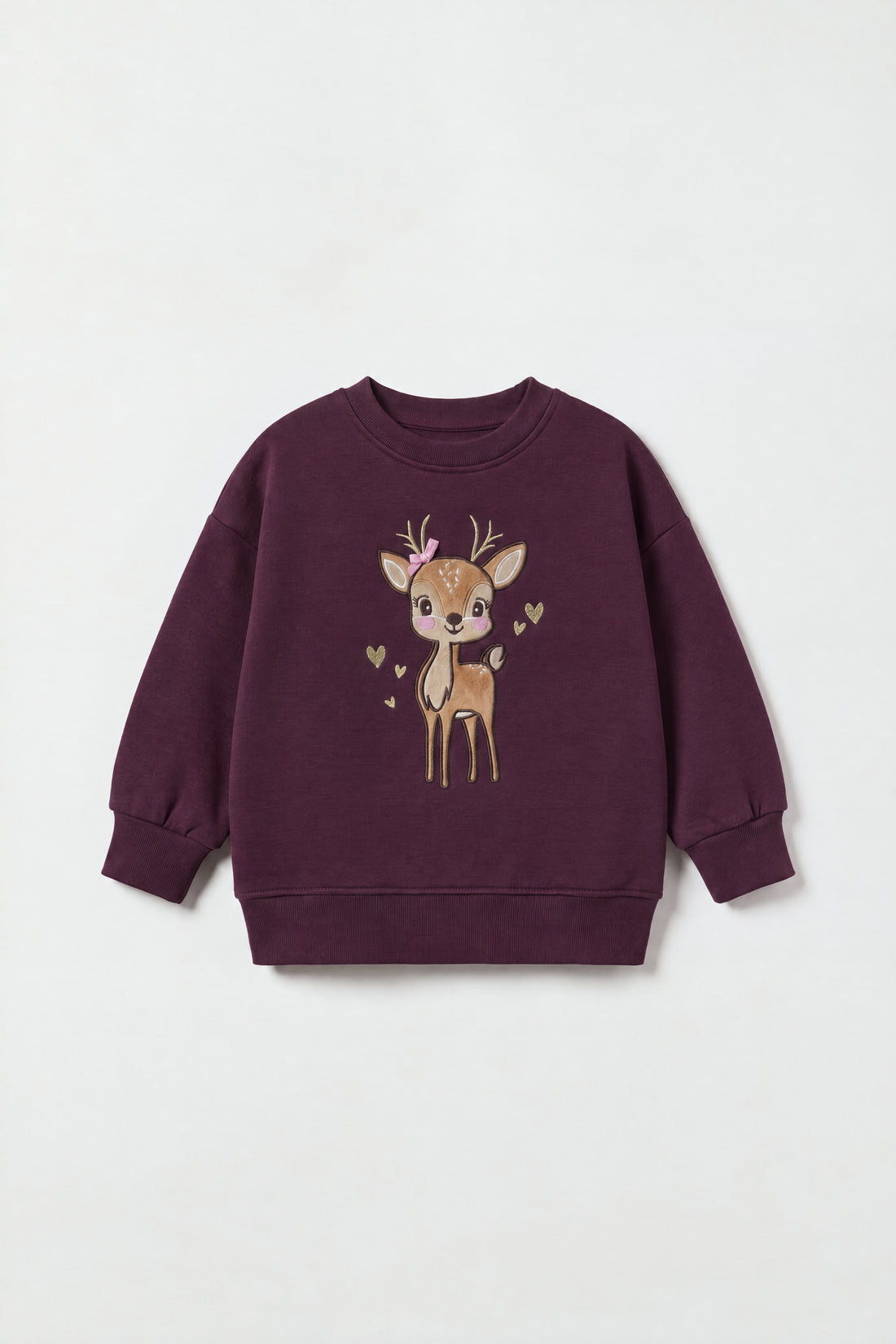 Girls wearing a boxy fit fleece sweatshirt with drop shoulders and embroidered deer appliqué design.