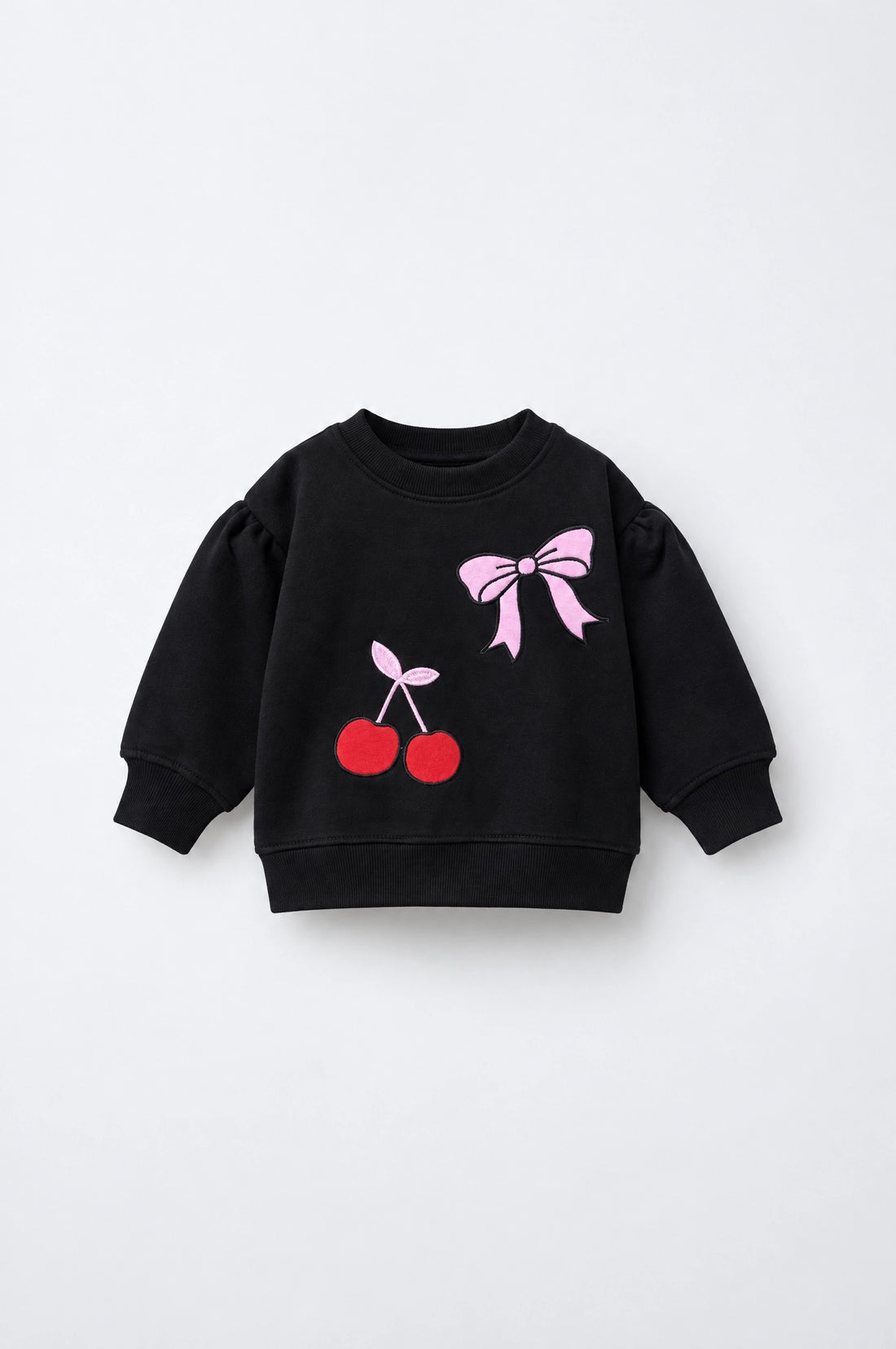 PTex Fashion girls’ black puff-sleeve sweatshirt with red cherry and pink bow appliqué, front view