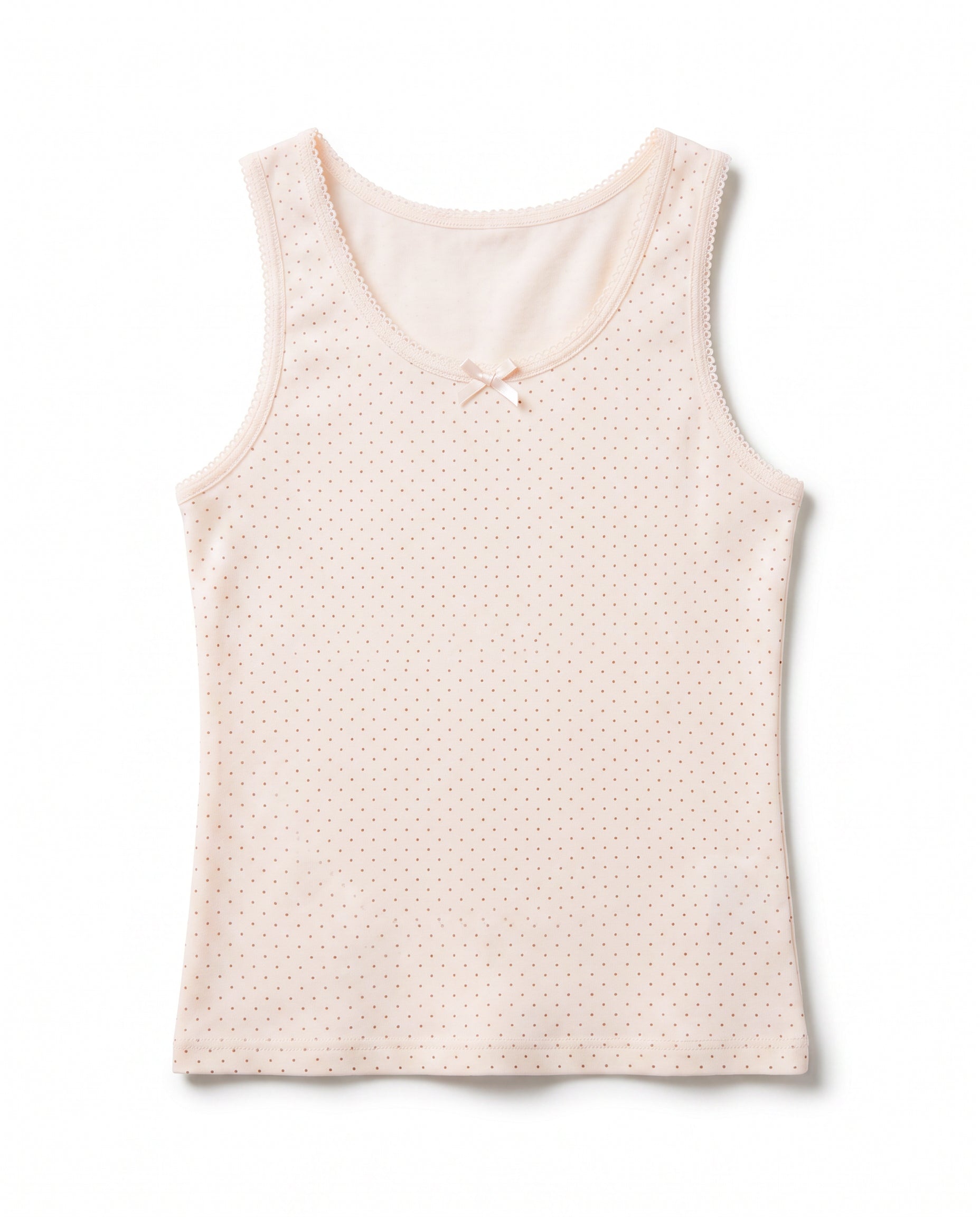 Girls soft peach mini dot sleeveless cotton tank top with lace trim neckline, armhole edging and small satin bow, flat lay product photo
