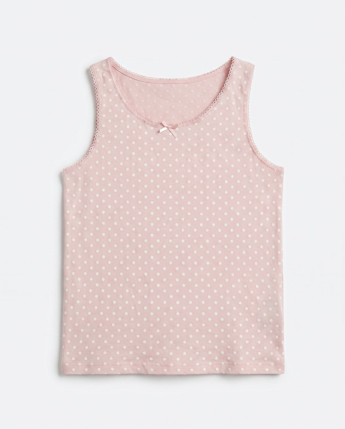 Girls pink polka dot sleeveless tank top with lace trim neckline and satin bow, flat lay product photo
