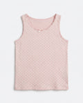Girls pink polka dot sleeveless tank top with lace trim neckline and satin bow, flat lay product photo