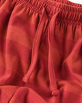Close-up of girls’ soft cotton red striped palazzo trousers with elastic waistband and drawstring