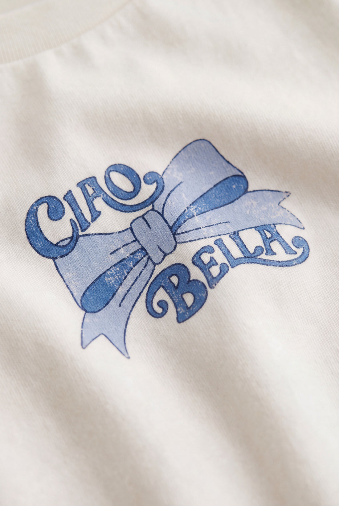 Girls soft cotton full-sleeve T-shirt with comfortable crew neckline, lightweight fit and front bow graphic.
