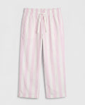 Close-up leg detail:
Close-up of girls' straight-cut palazzo pant leg panel showing bold blush pink and off-white vertical stripe woven cotton fabric with soft natural folds and clean single-needle hemline stitching.