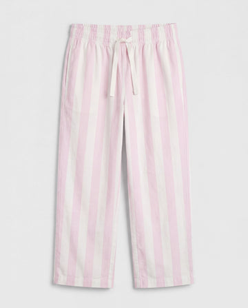 Close-up leg detail:
Close-up of girls' straight-cut palazzo pant leg panel showing bold blush pink and off-white vertical stripe woven cotton fabric with soft natural folds and clean single-needle hemline stitching.