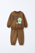 Baby wearing a brown sweatshirt and jogger set with raccoon graphic, elasticated waistband and relaxed infant-friendly fit.