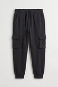 PTex Fashion kids' charcoal cargo jogger pants with drawcord waist and flap pockets, front view