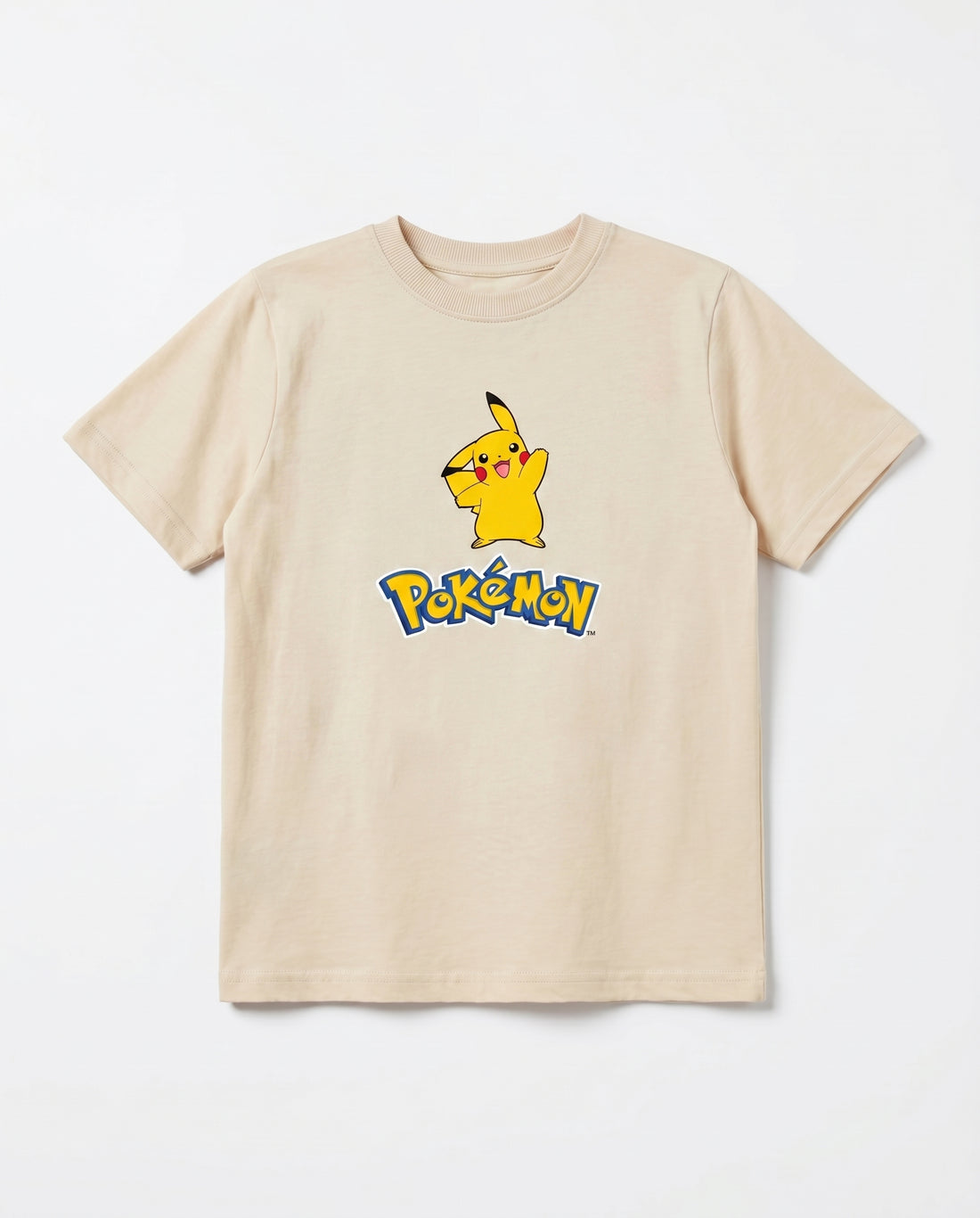 Young boy showing the back of a cream kids' t-shirt with a bold graffiti-style Pikachu winking face graphic and lightning bolt details