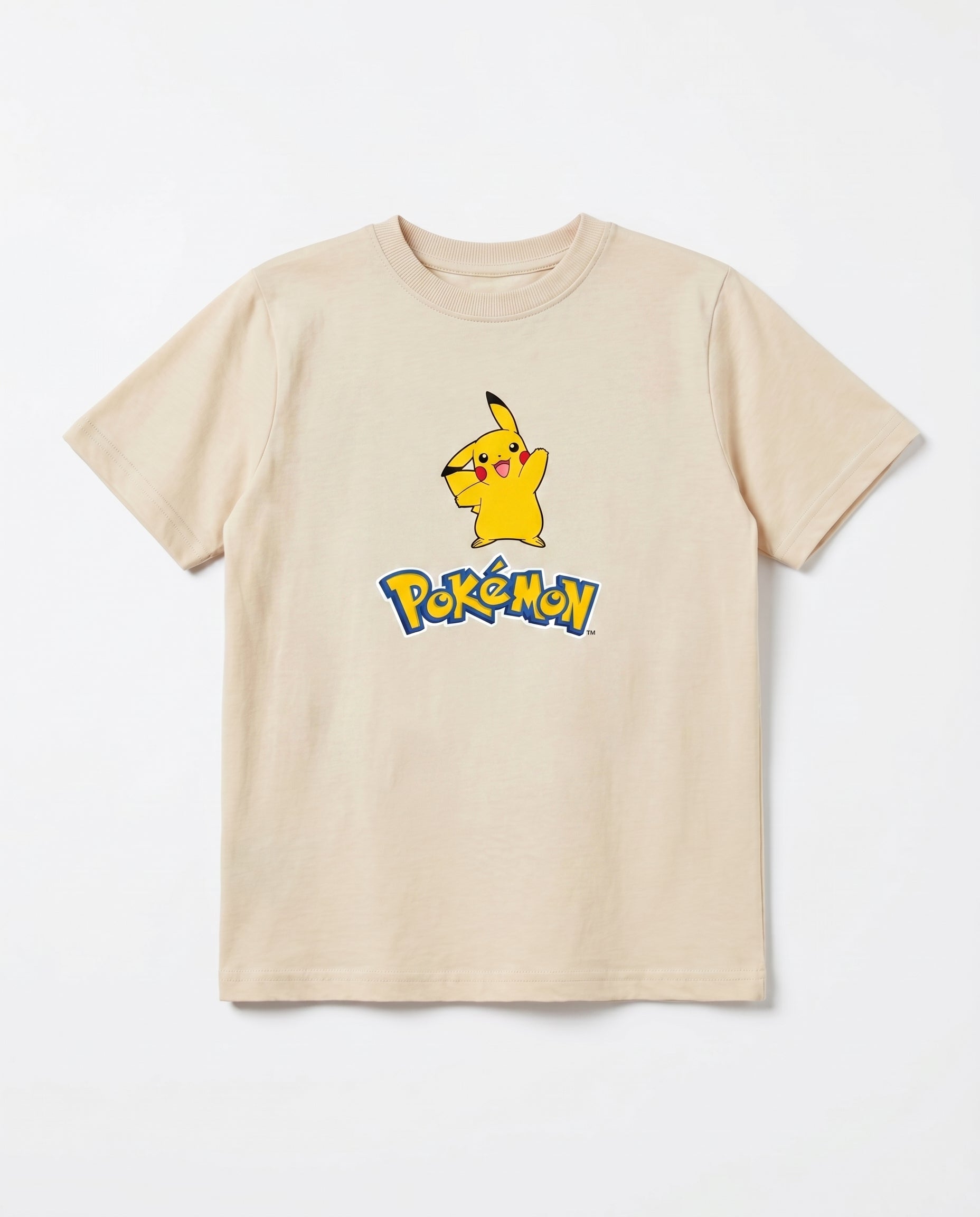 Flat lay of a cream boys' short-sleeve t-shirt with Pikachu character graphic and bold cartoon logo print on the chest