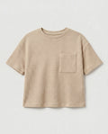 Full flat lay front view:
Kids' drop shoulder waffle cotton t-shirt in sand displayed flat lay on a white background, showing a relaxed boxy silhouette, ribbed crew neckline, short sleeves with ribbed cuffs, tonal chest patch pocket, and finished base hem.