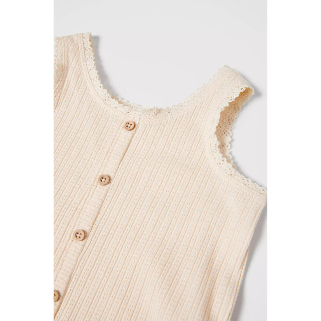 Sleeveless girls open knit top with a round neck