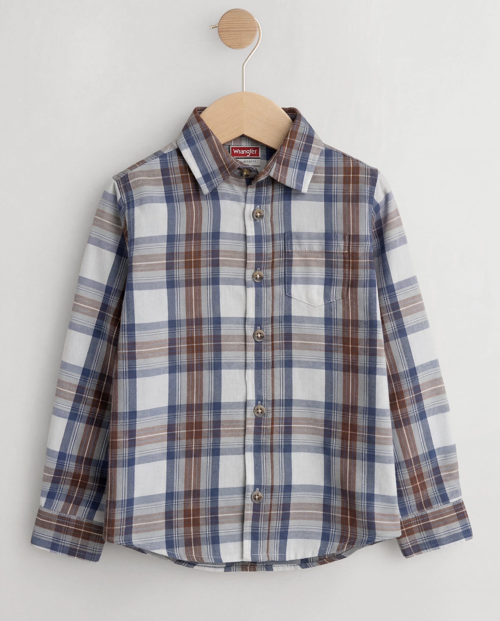 Plaid toddler shirt on a hanger against a white background