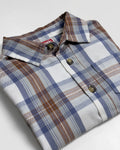 Plaid toddler shirt against a white background